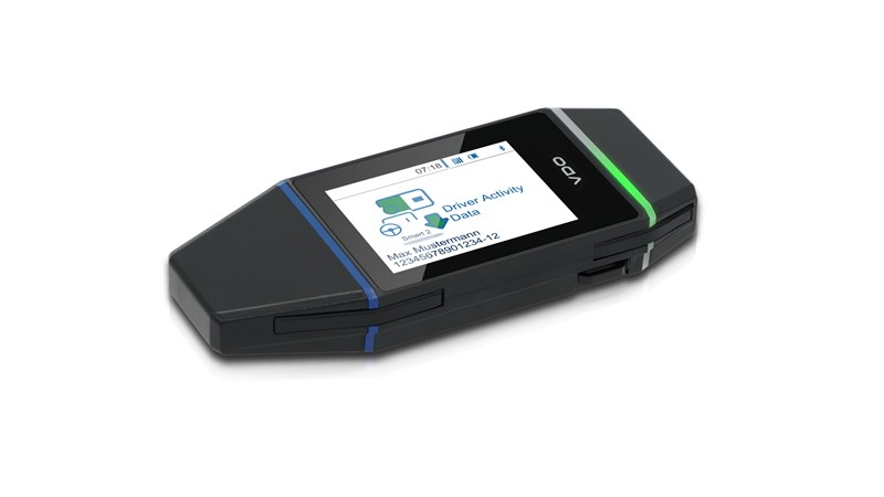 The VDO DLK Smart Download Key for efficient fleet management downloading driver activity data in side view.